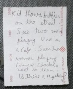 A story written behind a BEST Daily Pass. Kid blows bubbles on the street. Sees two men playing Uno in a Cafe. Sees two women playing Chinese Checkers next to them. Is there a Mystery?