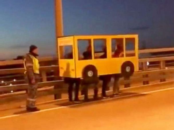 In 2018, A Group Of Russians Dressed Up As A Cardboard Bus To Cross A Vehicular Bridge
